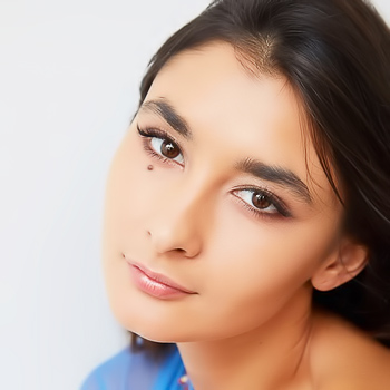 Brunette stretches ass cheeks and teases pink clit on sofa