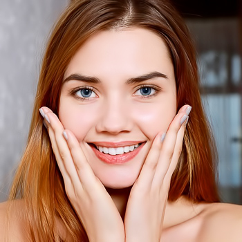 Sexy redhead peeling off her tight jeans