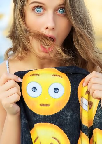 Eyes so blue they make the sea in the background look grey