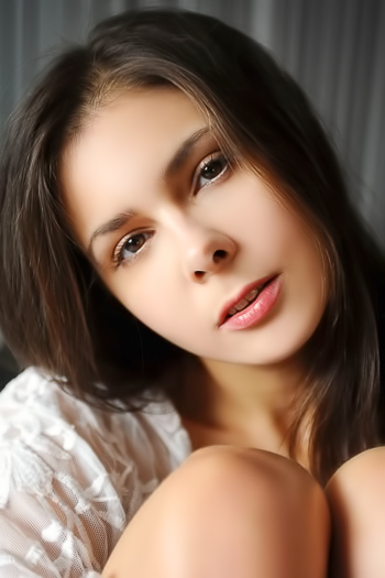 Luxurious brunette porn model hotly poses in lace peignoir